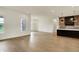 Spacious living room boasts light hardwood floors and recessed lighting at 5469 Harness Dr, Greenwood, IN 46143