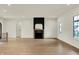 Open living area featuring hardwood floors and a modern fireplace at 5469 Harness Dr, Greenwood, IN 46143