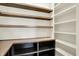 Open pantry features wooden shelves and under counter storage at 5469 Harness Dr, Greenwood, IN 46143