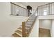 Stylish staircase featuring wood and iron railings that complement the modern interior design at 5469 Harness Dr, Greenwood, IN 46143