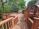 Multi-tiered deck leading to outdoor areas and features seating area and outdoor shed at 620 Valley Dr, Martinsville, IN 46151