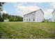Wide angle of a big yard with a patio, shed, lush lawn, and a well-maintained exterior at 975 Red Hills Ct, Lebanon, IN 46052
