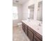Bathroom featuring double sinks, tiled floors, and a large window at 975 Red Hills Ct, Lebanon, IN 46052