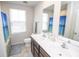 This is a bathroom with a dual vanity and a window at 975 Red Hills Ct, Lebanon, IN 46052