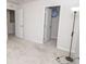 A view of a carpeted bedroom includes open doors and a closet at 975 Red Hills Ct, Lebanon, IN 46052