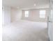 Bright bedroom featuring neutral carpet, two large windows, recessed lighting, and a closet at 975 Red Hills Ct, Lebanon, IN 46052