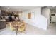 Bright eat-in kitchen featuring wooden table and chairs, kitchen island, and ample cabinet storage at 975 Red Hills Ct, Lebanon, IN 46052