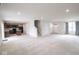 Large living space leading into the kitchen area, showcasing the open floor plan and natural light at 975 Red Hills Ct, Lebanon, IN 46052