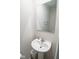Powder room with white sink and a large mirror at 975 Red Hills Ct, Lebanon, IN 46052
