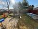 Backyard with a small patio, a grill, and gardening boxes at 1418 Osprey Way, Greenwood, IN 46143