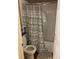 Compact bathroom with a toilet, a shower/tub, and a decorative shower curtain at 1418 Osprey Way, Greenwood, IN 46143