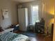Bright bedroom with natural light and storage, complemented by hardwood floors at 1418 Osprey Way, Greenwood, IN 46143