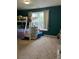 Bright bedroom with bunk beds, neutral carpet, and a large window for natural light at 1418 Osprey Way, Greenwood, IN 46143