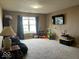 Spacious bonus room with a window and a television on the wall at 1418 Osprey Way, Greenwood, IN 46143