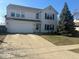 Traditional two-story home with a two-car garage and concrete driveway at 1418 Osprey Way, Greenwood, IN 46143