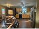 Well-equipped kitchen with stainless steel appliances, solid countertops, and stylish lighting fixtures at 1418 Osprey Way, Greenwood, IN 46143