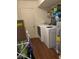 Functional laundry area with washer, dryer, and convenient shelving for storage at 1418 Osprey Way, Greenwood, IN 46143