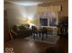 Cozy living area with natural light from the large window, next to a comfortable seating area at 1418 Osprey Way, Greenwood, IN 46143
