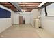 Unfinished basement area with laundry hookups and storage space at 409 Dale St, Martinsville, IN 46151