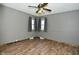Bedroom with hardwood floors, ceiling fan, and two windows at 409 Dale St, Martinsville, IN 46151