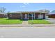Charming brick ranch home with a well-maintained front yard and attached garage at 409 Dale St, Martinsville, IN 46151