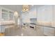 Gourmet kitchen with island, white cabinets, and quartz countertops at 4325 Hamilton Run, Zionsville, IN 46077