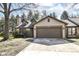 Charming home with a two-car garage, stone accents, and dormer windows at 8191 Frisco Way, Indianapolis, IN 46240