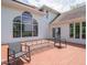 A spacious back deck features modern seating, large windows and doors opening into the residence at 5784 N 600 E, Greenfield, IN 46140