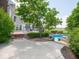Landscaped backyard with an elevated deck overlooking a large in-ground pool at 5784 N 600 E, Greenfield, IN 46140