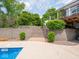 Multi-level backyard featuring stone retaining walls, steps, pool, and lush landscaping at 5784 N 600 E, Greenfield, IN 46140