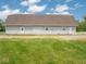 Back of the barn exterior features doors for access with a yard and well kept lawn at 5784 N 600 E, Greenfield, IN 46140