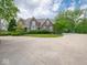Charming brick home with large driveway featuring an outdoor basketball court at 5784 N 600 E, Greenfield, IN 46140