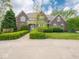 Charming two-story brick home with a manicured lawn and inviting walkway at 5784 N 600 E, Greenfield, IN 46140