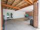 Covered patio area with exposed wooden beams and open space for recreational activities at 5784 N 600 E, Greenfield, IN 46140