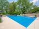 Beautiful backyard with an in-ground pool, mature trees, and a well-manicured lawn at 5784 N 600 E, Greenfield, IN 46140