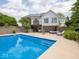 A beautiful backyard pool with spacious patio and outdoor living area at 5784 N 600 E, Greenfield, IN 46140