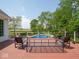 Sparkling backyard pool surrounded by lush landscaping, offering a refreshing escape at 5784 N 600 E, Greenfield, IN 46140