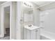 Updated bathroom with white vanity and bathtub at 606 N Colorado Ave, Indianapolis, IN 46201