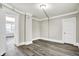 Spacious bedroom with an open doorway to another room at 606 N Colorado Ave, Indianapolis, IN 46201