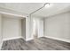 Spacious bedroom with wood-look flooring and neutral walls at 606 N Colorado Ave, Indianapolis, IN 46201