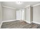 Charming bedroom with wood-look floors and neutral walls at 606 N Colorado Ave, Indianapolis, IN 46201