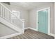 Entryway with staircase, light gray walls, and wood-look floors at 606 N Colorado Ave, Indianapolis, IN 46201