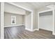 Bright hallway with hardwood floors and access to other rooms at 606 N Colorado Ave, Indianapolis, IN 46201