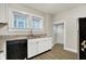 Updated kitchen, featuring granite countertops, white cabinets and stainless steel appliances at 606 N Colorado Ave, Indianapolis, IN 46201