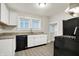 Modern kitchen with white cabinets, granite countertops, and stainless steel appliances at 606 N Colorado Ave, Indianapolis, IN 46201