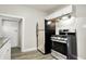 Modern kitchen with stainless steel appliances and granite countertops at 606 N Colorado Ave, Indianapolis, IN 46201