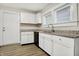 Modern kitchen with white cabinets, granite countertops and stainless steel appliances at 606 N Colorado Ave, Indianapolis, IN 46201