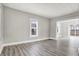 Living room with neutral walls and wood-look floors at 606 N Colorado Ave, Indianapolis, IN 46201
