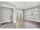 Spacious living room with wood-look floors and access to a deck at 606 N Colorado Ave, Indianapolis, IN 46201