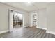 Living room with sliding glass doors to deck and kitchen access at 606 N Colorado Ave, Indianapolis, IN 46201